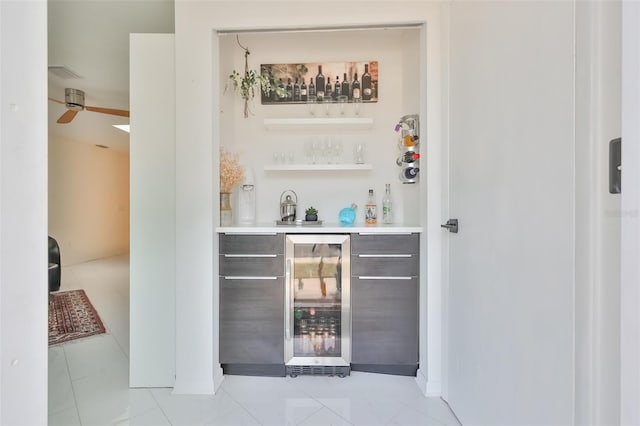 bar featuring light tile patterned floors and beverage cooler