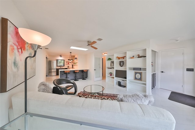 living room featuring ceiling fan