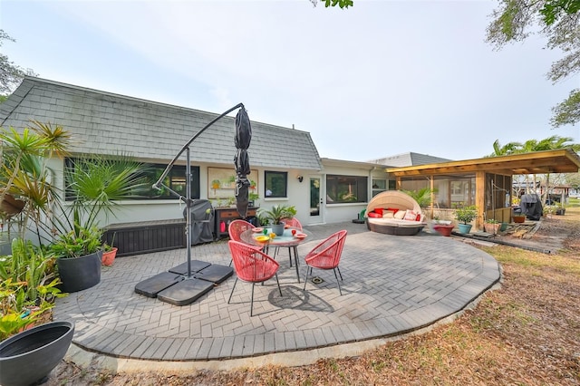 view of patio with a sunroom