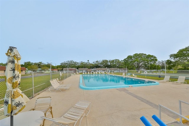 view of swimming pool with a patio