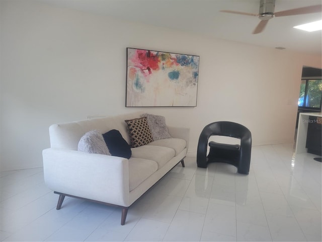 tiled living room featuring ceiling fan