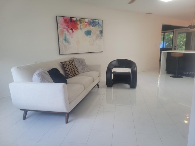 tiled living room featuring lofted ceiling