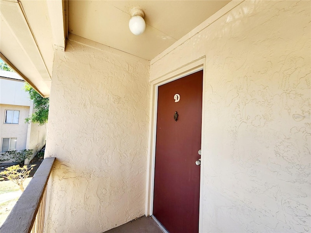 property entrance with a balcony