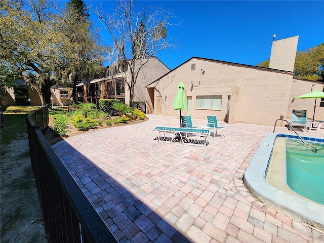 view of swimming pool featuring a patio