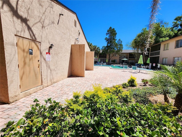 view of patio with a community pool