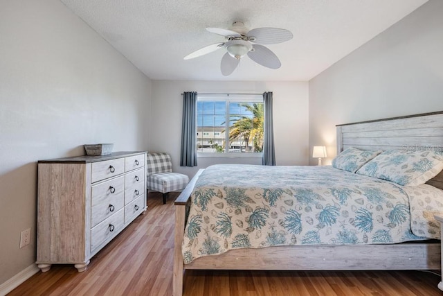 bedroom featuring light hardwood / wood-style floors and ceiling fan