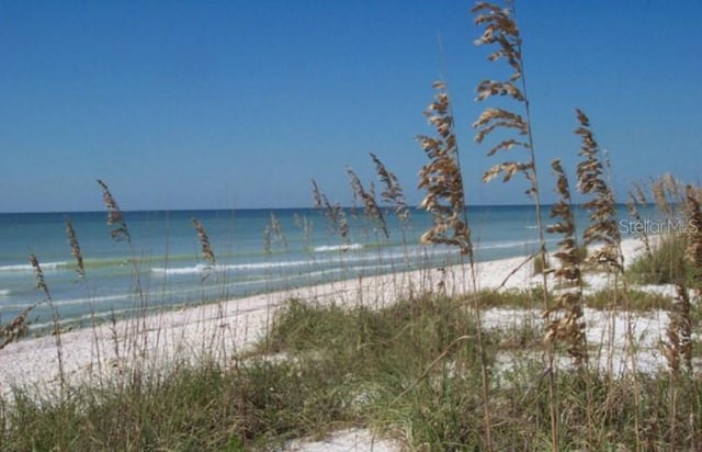 view of water feature with a beach view