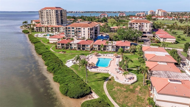 birds eye view of property with a water view