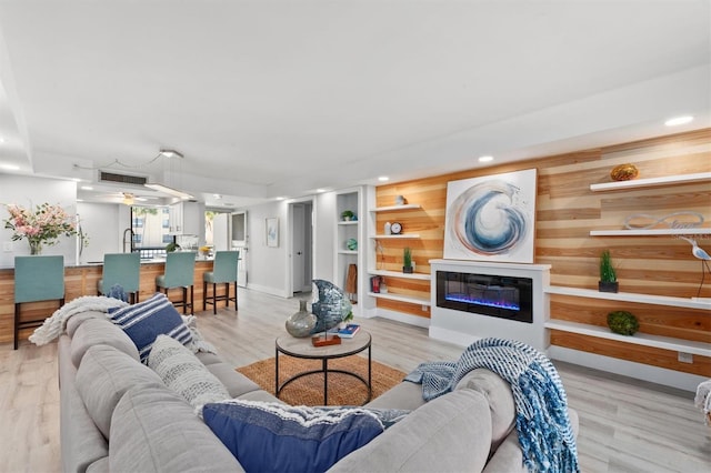 living room with light hardwood / wood-style floors