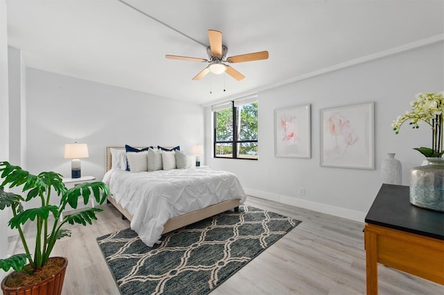 bedroom featuring ceiling fan and light wood-type flooring