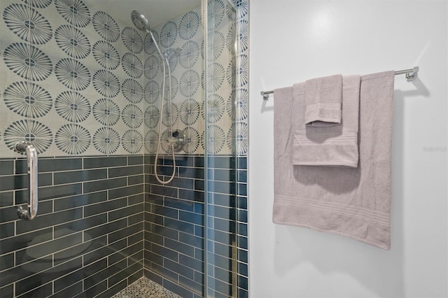 bathroom with tiled shower