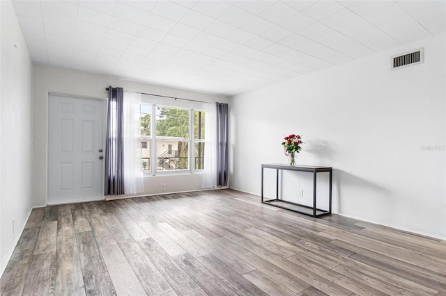 spare room with light wood-type flooring