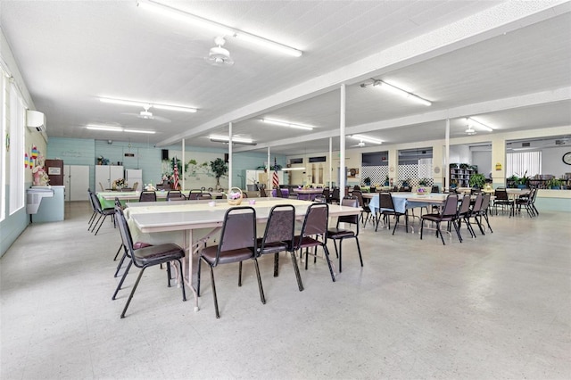 dining area featuring a wall mounted air conditioner