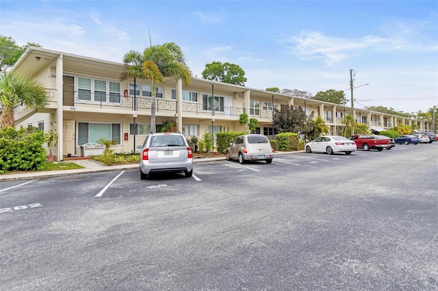 view of property featuring uncovered parking