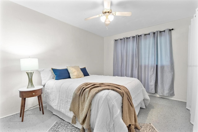 bedroom featuring finished concrete flooring and ceiling fan