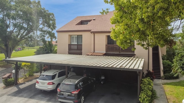 back of house with a carport