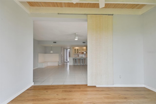 unfurnished room with tile patterned floors, ceiling fan, and wooden ceiling