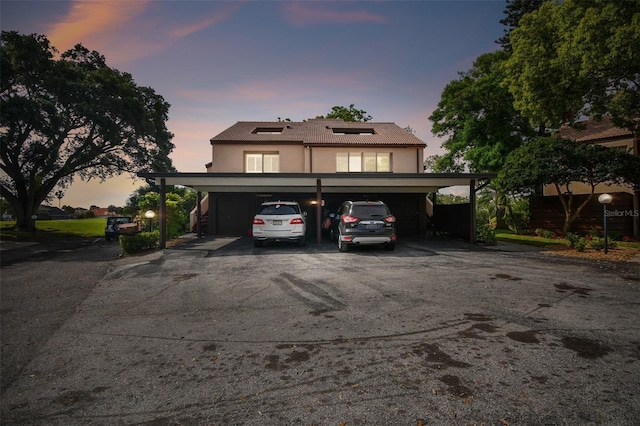 front facade featuring a carport