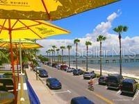 view of road featuring a view of the beach and a water view