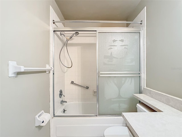 full bathroom with shower / bath combination with glass door, toilet, and vanity