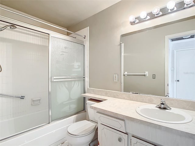 full bathroom with shower / bath combination with glass door, toilet, and vanity