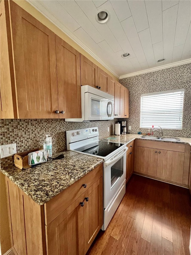 kitchen featuring crown molding, tasteful backsplash, dark hardwood / wood-style flooring, and white appliances