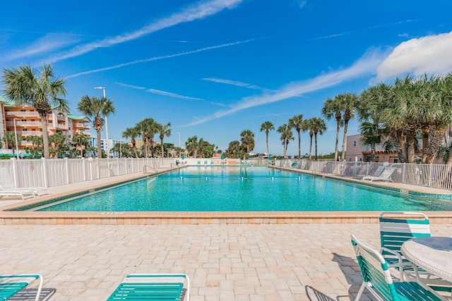 view of swimming pool with a patio area