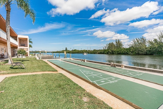 view of nearby features featuring a water view and a lawn