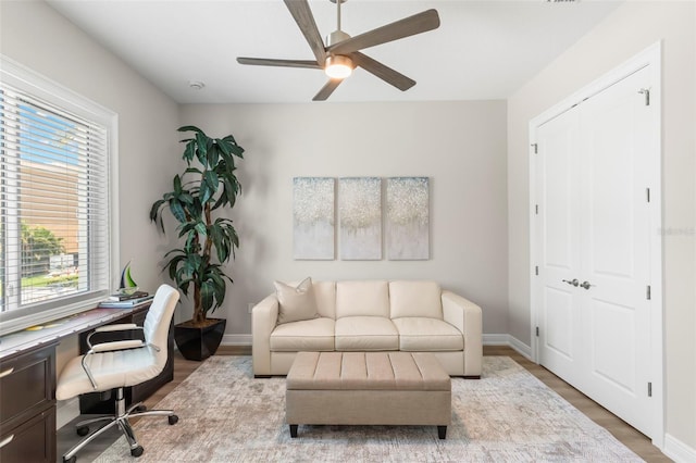 office space with ceiling fan and wood-type flooring