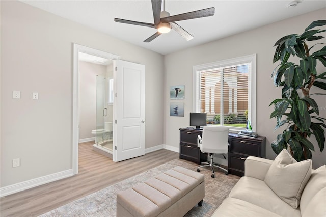 home office featuring ceiling fan and light wood-type flooring