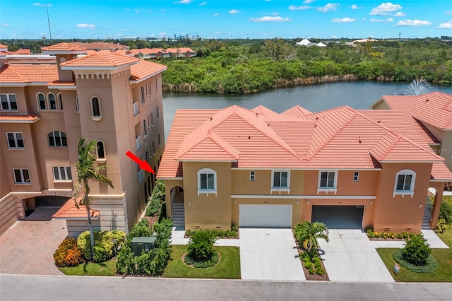 birds eye view of property with a water view