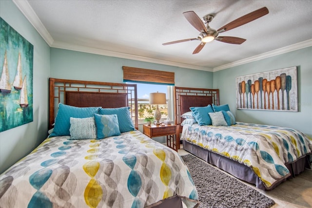 bedroom featuring a textured ceiling, ceiling fan, and ornamental molding