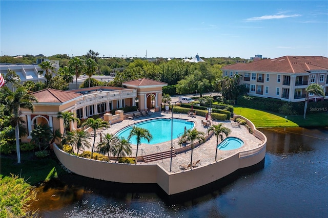 view of pool featuring a patio area and a lawn