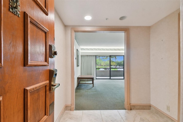 corridor with light tile flooring