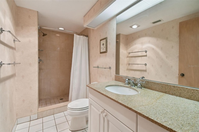 bathroom with walk in shower, tile floors, toilet, and oversized vanity