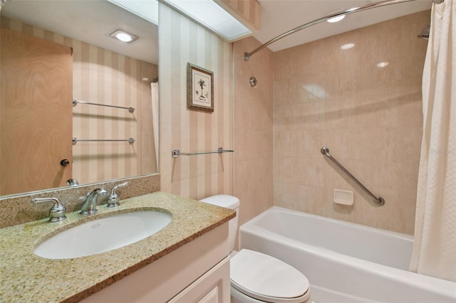 full bathroom with vanity, shower / tub combo with curtain, and toilet