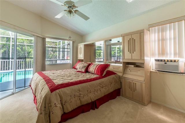 bedroom featuring light carpet, ceiling fan, access to exterior, and vaulted ceiling