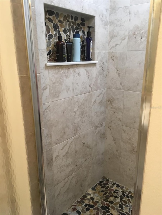 interior space featuring a tile shower