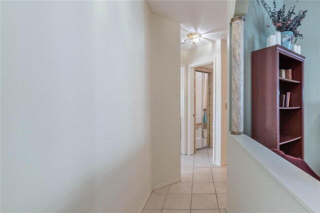 corridor with light tile patterned floors