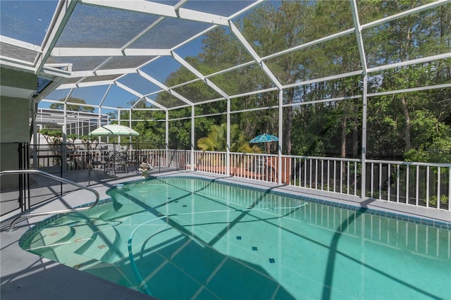 view of pool featuring a lanai and a patio area