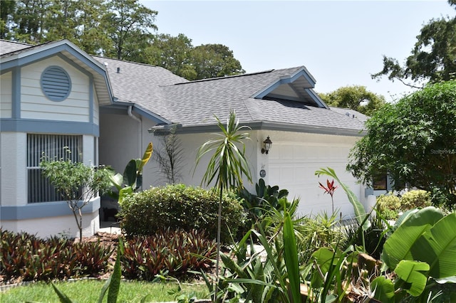 view of side of property featuring a garage