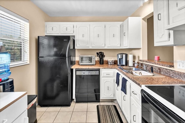 kitchen featuring white cabinetry, light tile floors, black appliances, and sink