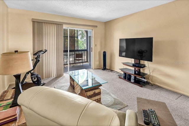 carpeted living room featuring a textured ceiling