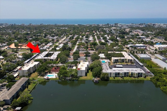 birds eye view of property with a water view