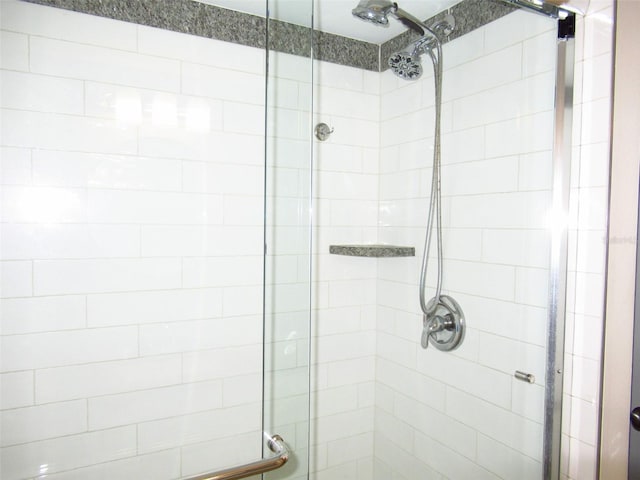 full bath featuring a shower stall