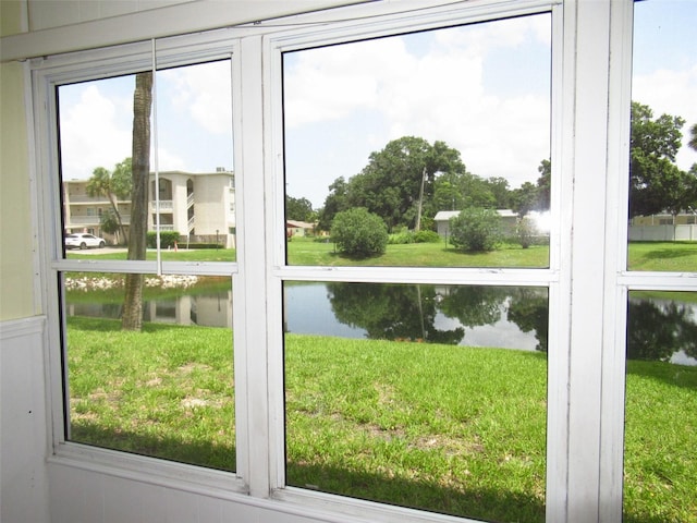 doorway featuring a water view and plenty of natural light