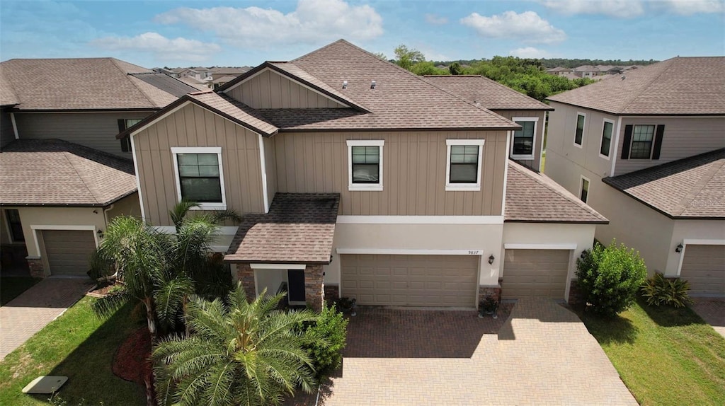 view of front of property with a front lawn and a garage