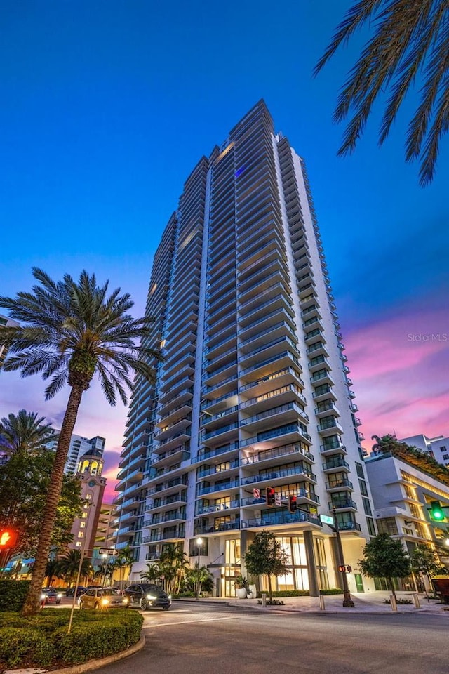 view of outdoor building at dusk