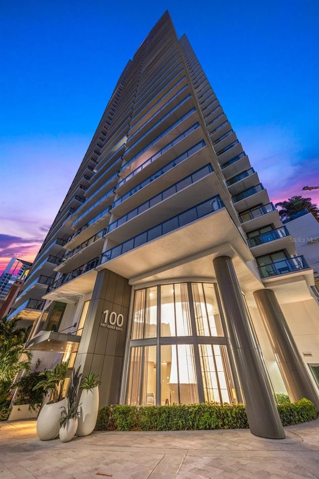 view of outdoor building at dusk