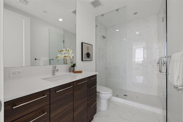 bathroom featuring tile floors, toilet, vanity, and an enclosed shower